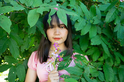 Portrait of woman in plant