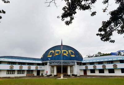 View of building against cloudy sky