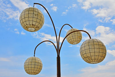 Low angle view of street light against sky