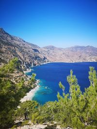 Scenic view of sea against clear blue sky
