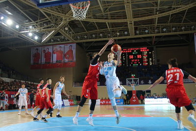 Group of people playing basketball court