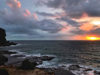 Scenic view of sea against dramatic sky