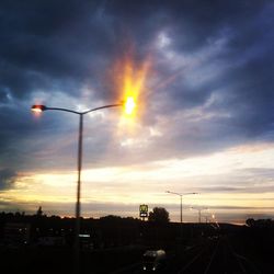 Road against cloudy sky at sunset