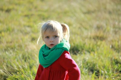 Full length of girl standing on grassy field