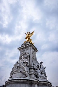 Low angle view of statue of liberty against sky