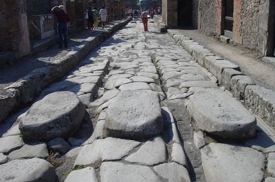 People on cobblestone street