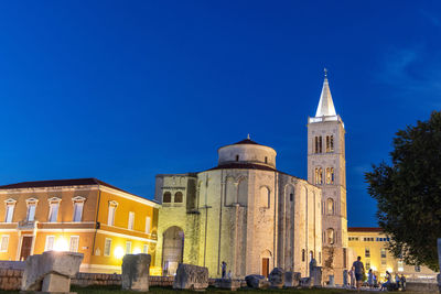 Low angle view of church against blue sky