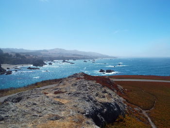 Scenic view of sea against clear blue sky