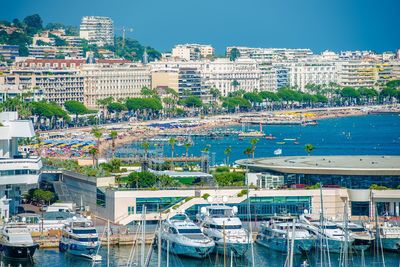 High angle view of harbor by buildings in city