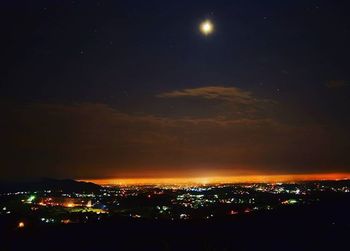 Illuminated cityscape at night