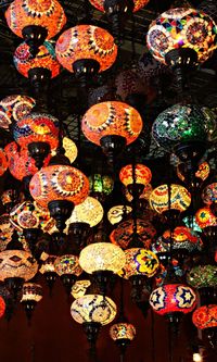 Low angle view of multi colored lanterns hanging on ceiling