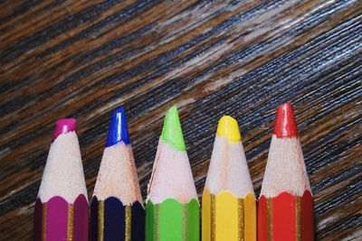 Close-up of multi colored pencils on table