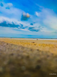 Surface level of beach against sky