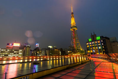 Illuminated buildings in city at night