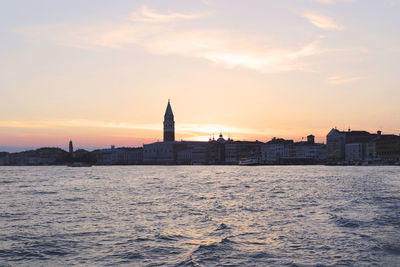 View of buildings against sky during sunset