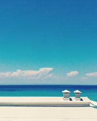 Scenic view of sea against blue sky