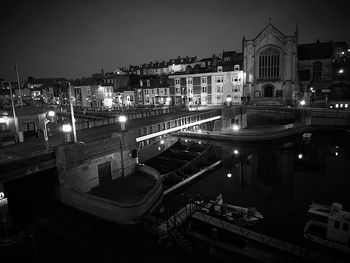 High angle view of illuminated buildings against sky at weymouth