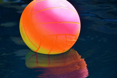 Close-up of orange ball in swimming pool