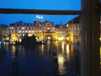 Reflection of illuminated buildings in water at night