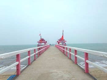 Pier over sea against clear sky