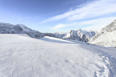 Scenic view of mountains against cloudy sky