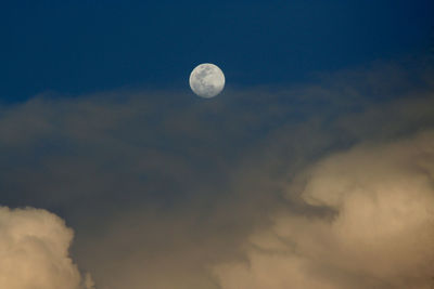 Low angle view of moon against sky at night