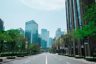 Road in city against sky