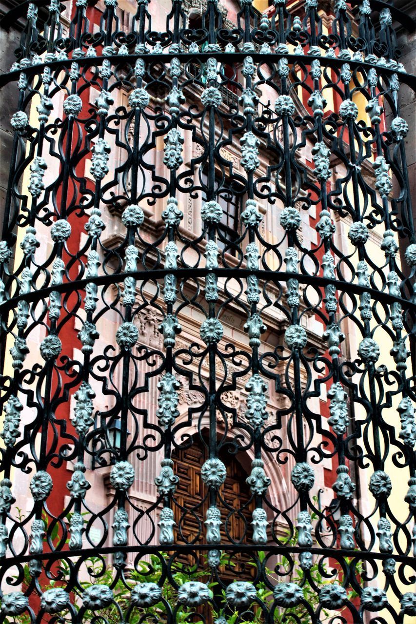 FULL FRAME SHOT OF PATTERNED WINDOW ON BUILDING