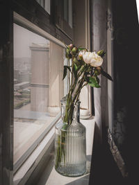 Flower vase on window sill