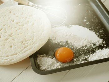 High angle view of egg in container on table