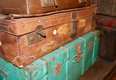 Close-up of old stacked trunks