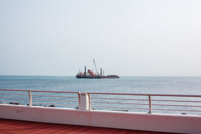 Crane on a ship at sea on a sunny day, landscape