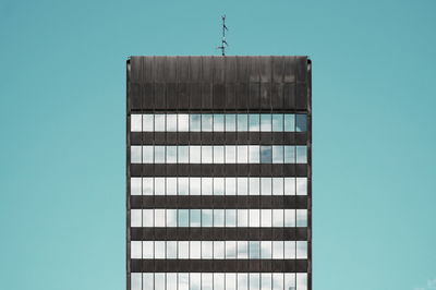 Low angle view of modern building against clear sky