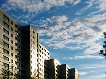 Modern buildings in city against sky