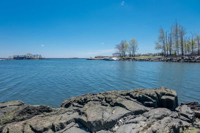 Scenic view of sea against clear blue sky