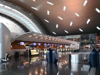 People walking in illuminated airport