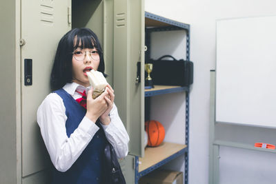 Portrait of woman eating food