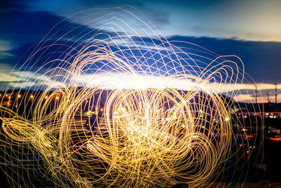 Light trails against sky at night