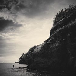 Scenic view of sea against cloudy sky