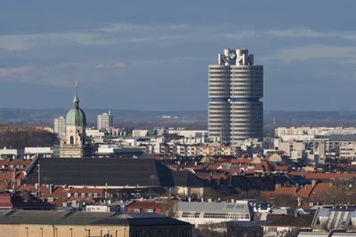 Buildings in city against sky