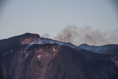 Scenic view of volcanic mountain against clear sky