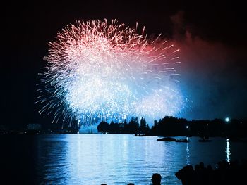 Firework display at night