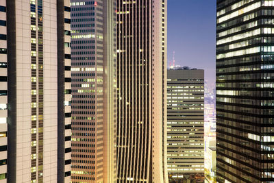 Modern buildings in city against sky