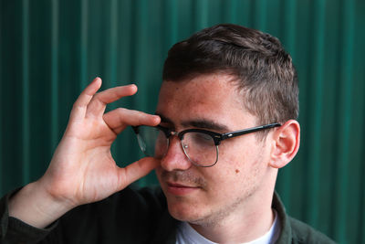 Close-up of young man wearing sunglasses