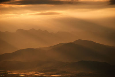 Scenic view of mountains at sunset