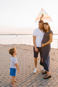 Rear view of woman walking on street