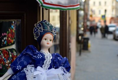 Midsection of  doll wearing traditional costume at store