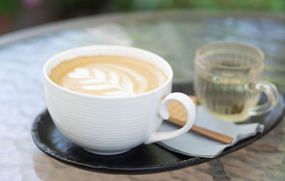 Close-up of cappuccino served on table