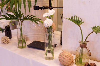 Flowers in glass vase on table