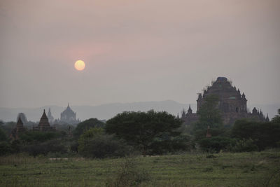 Built structure against sky during sunset